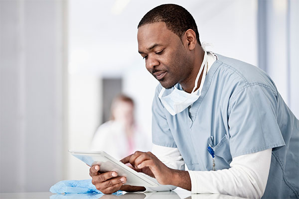 Medical worker using a tablet